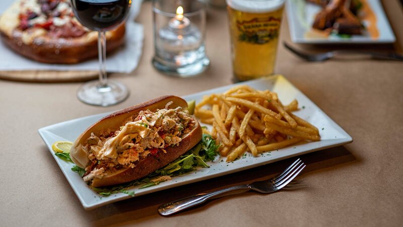 Lobster roll sandwich with side of french fries