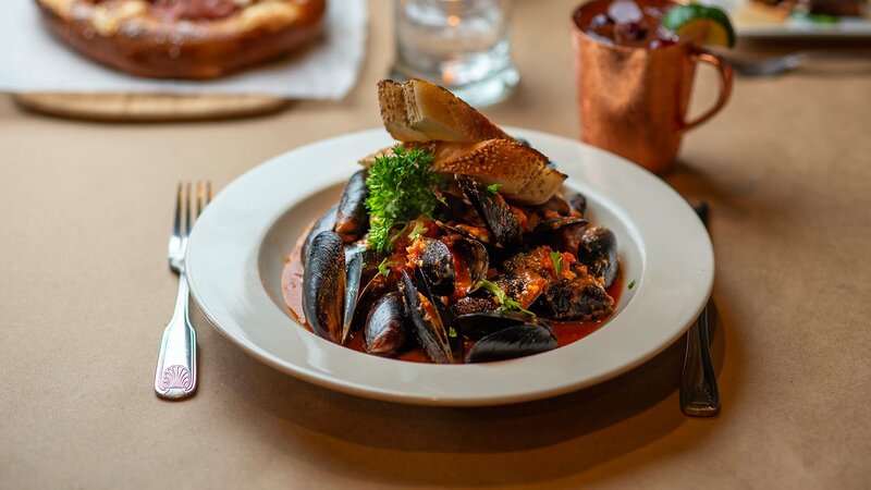 Mussels topped with toasted bread