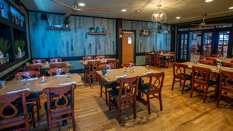 Side dining room with view of many set tables